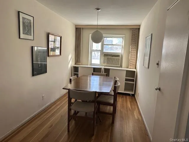 a view of a dining room with furniture and window