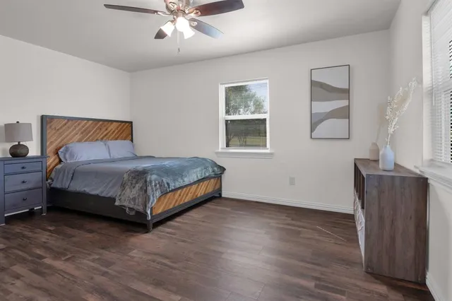a bedroom with a bed and window