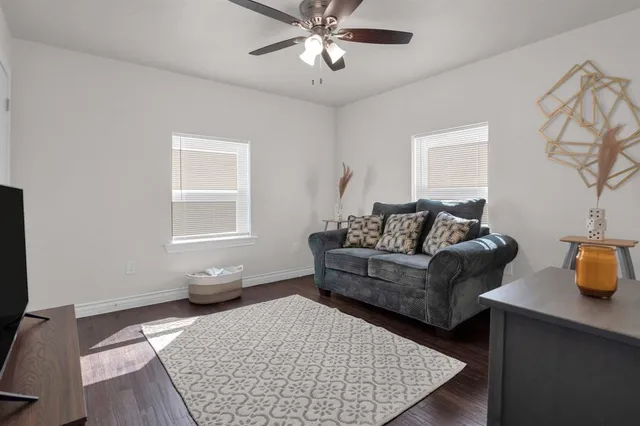 a living room with furniture and a window