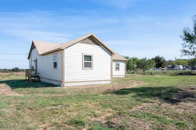 a view of a field with trees