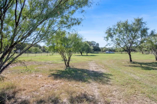 a front view of a house with yard