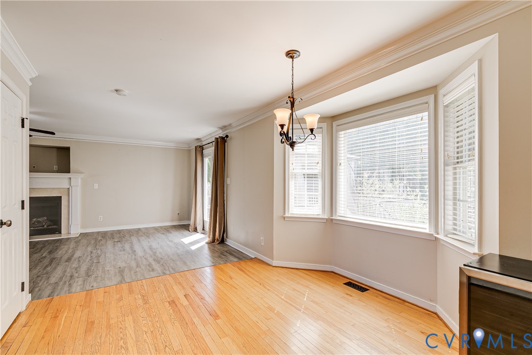 4318 Rose Glen Place Midlothian, VA 23015 - Photo 13 of 33 a view of an empty room with a window and wooden floor