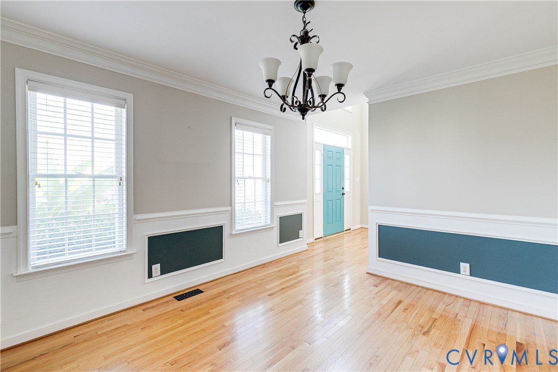 4318 Rose Glen Place Midlothian, VA 23015 - Photo 15 of 33 a view of empty room with wooden floor and fireplace