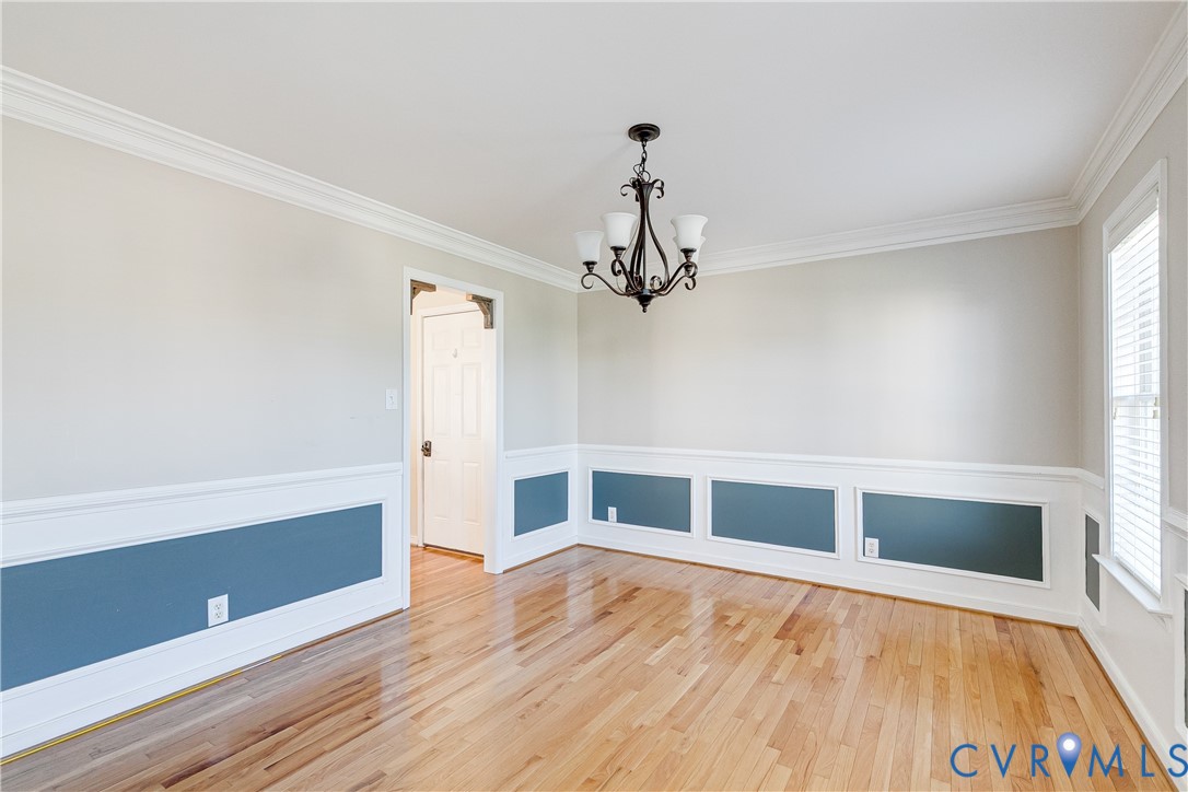 4318 Rose Glen Place Midlothian, VA 23015 - Photo 16 of 33 a view of an empty room with wooden floor and a window