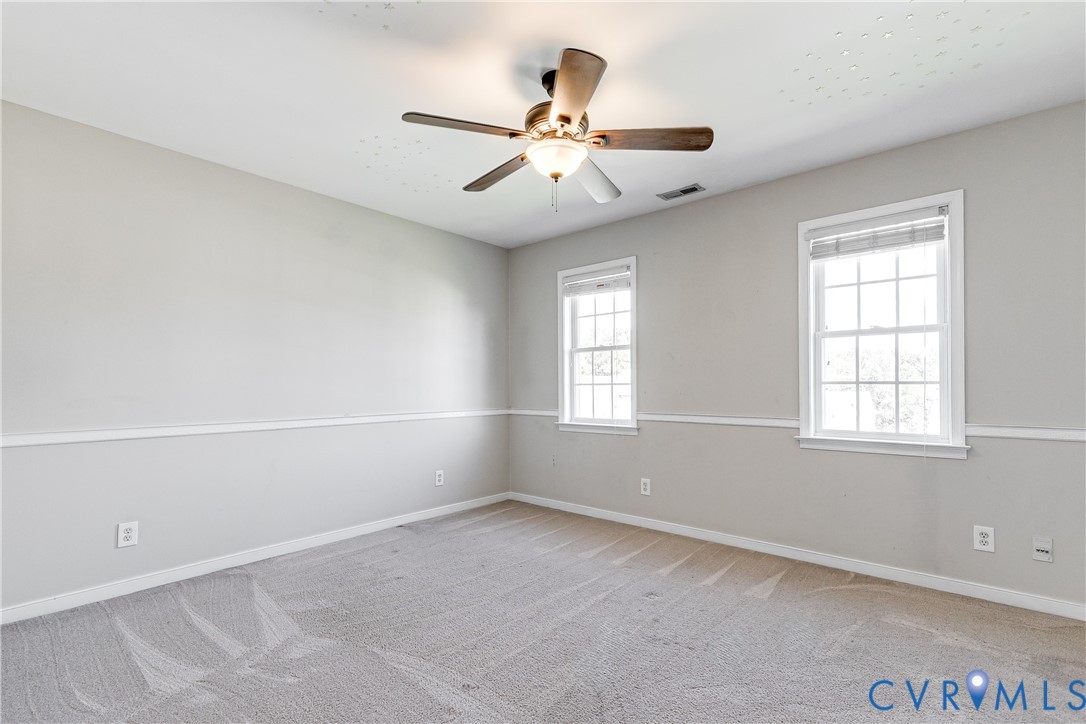 4318 Rose Glen Place Midlothian, VA 23015 - Photo 24 of 33 an empty room with windows and fan