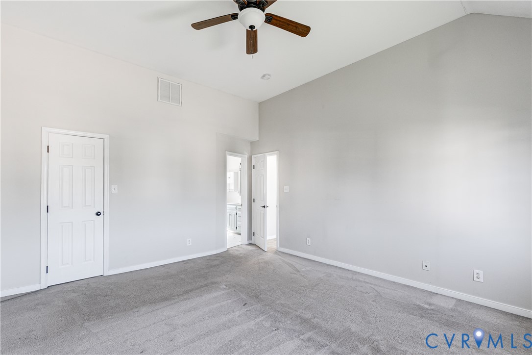 4318 Rose Glen Place Midlothian, VA 23015 - Photo 28 of 33 an empty room with a ceiling fan and window