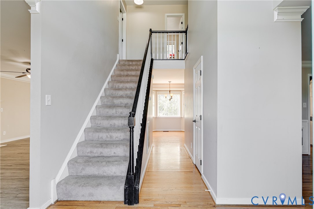 4318 Rose Glen Place Midlothian, VA 23015 - Photo 3 of 33 a view of a hallway with wooden floor and entryway