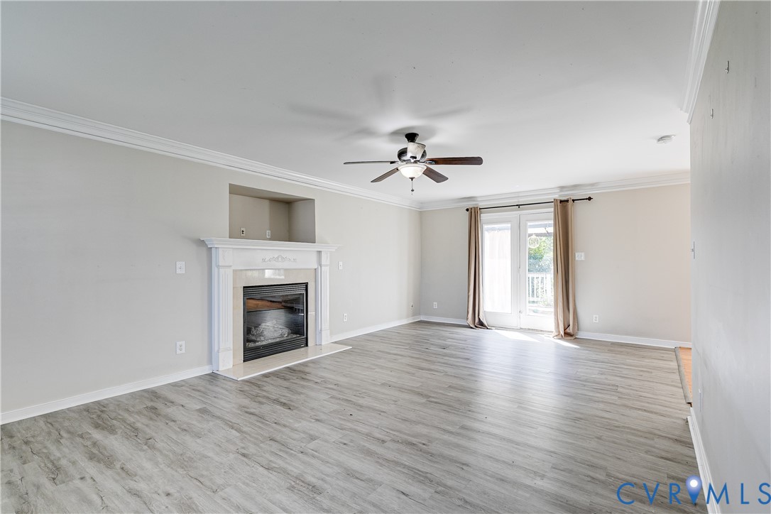 4318 Rose Glen Place Midlothian, VA 23015 - Photo 5 of 33 a view of an empty room with window and fireplace