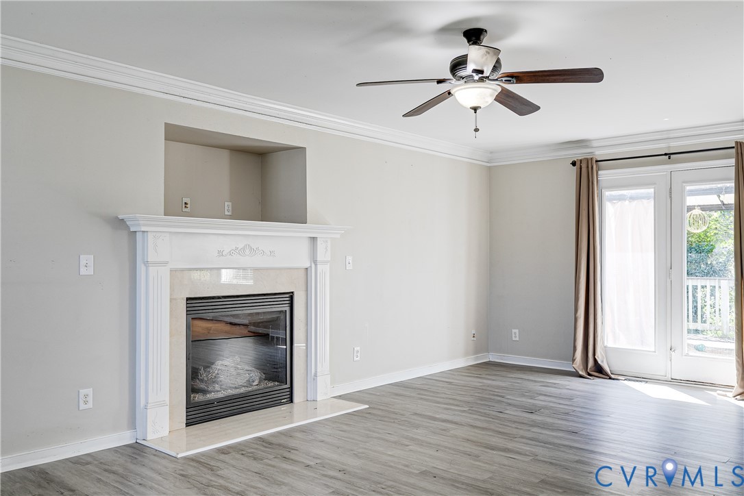 4318 Rose Glen Place Midlothian, VA 23015 - Photo 6 of 33 a view of an empty room with window and wooden floor