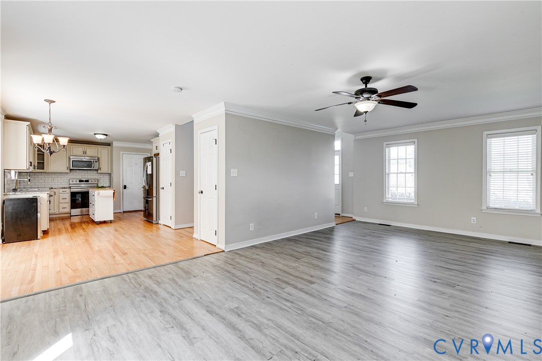 4318 Rose Glen Place Midlothian, VA 23015 - Photo 8 of 33 a view of an empty room with window and wooden floor