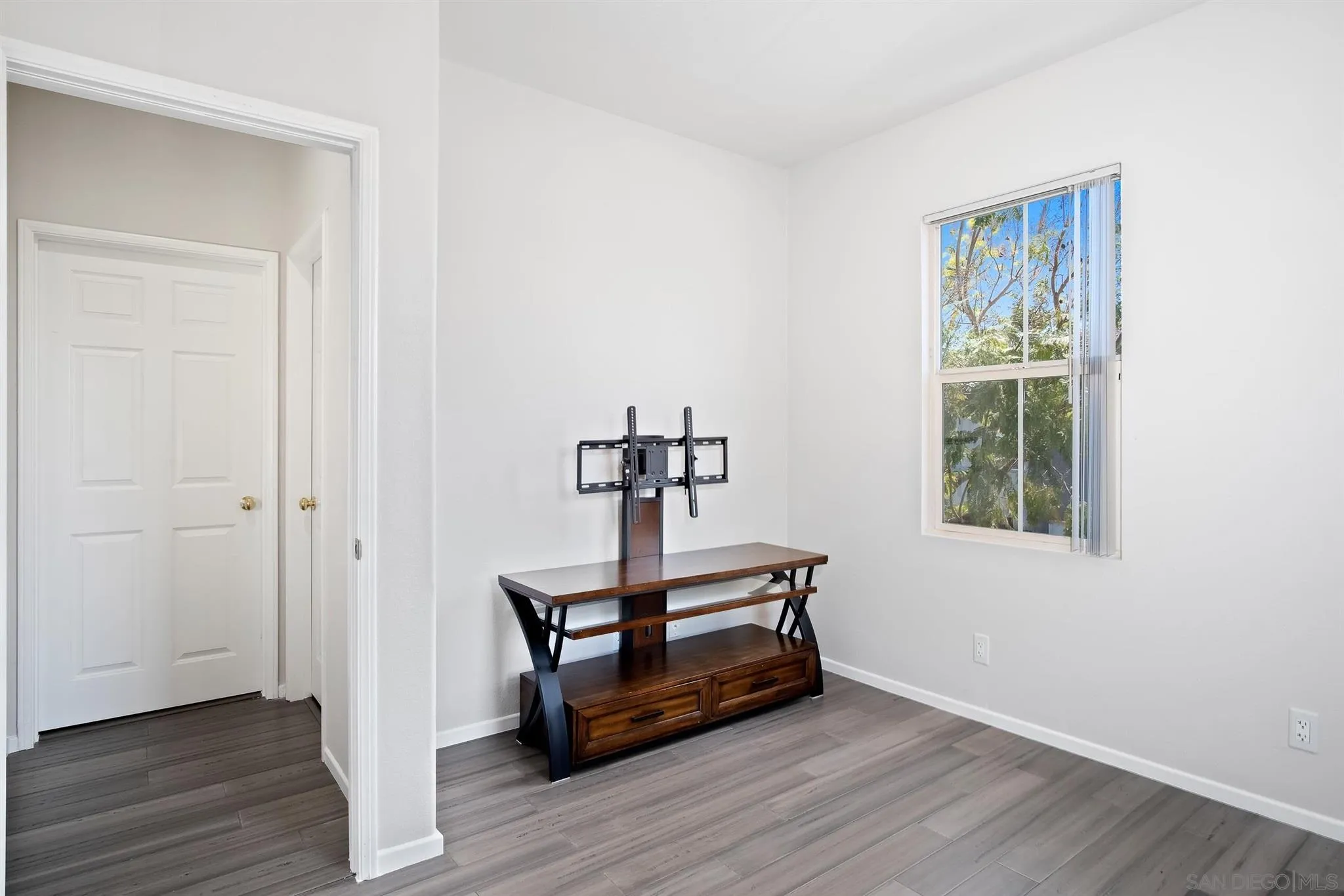 2732 Crown Ridge Road, Unit 1 Chula Vista, CA 91915 - Photo 12 of 32 a room with wooden floor and window