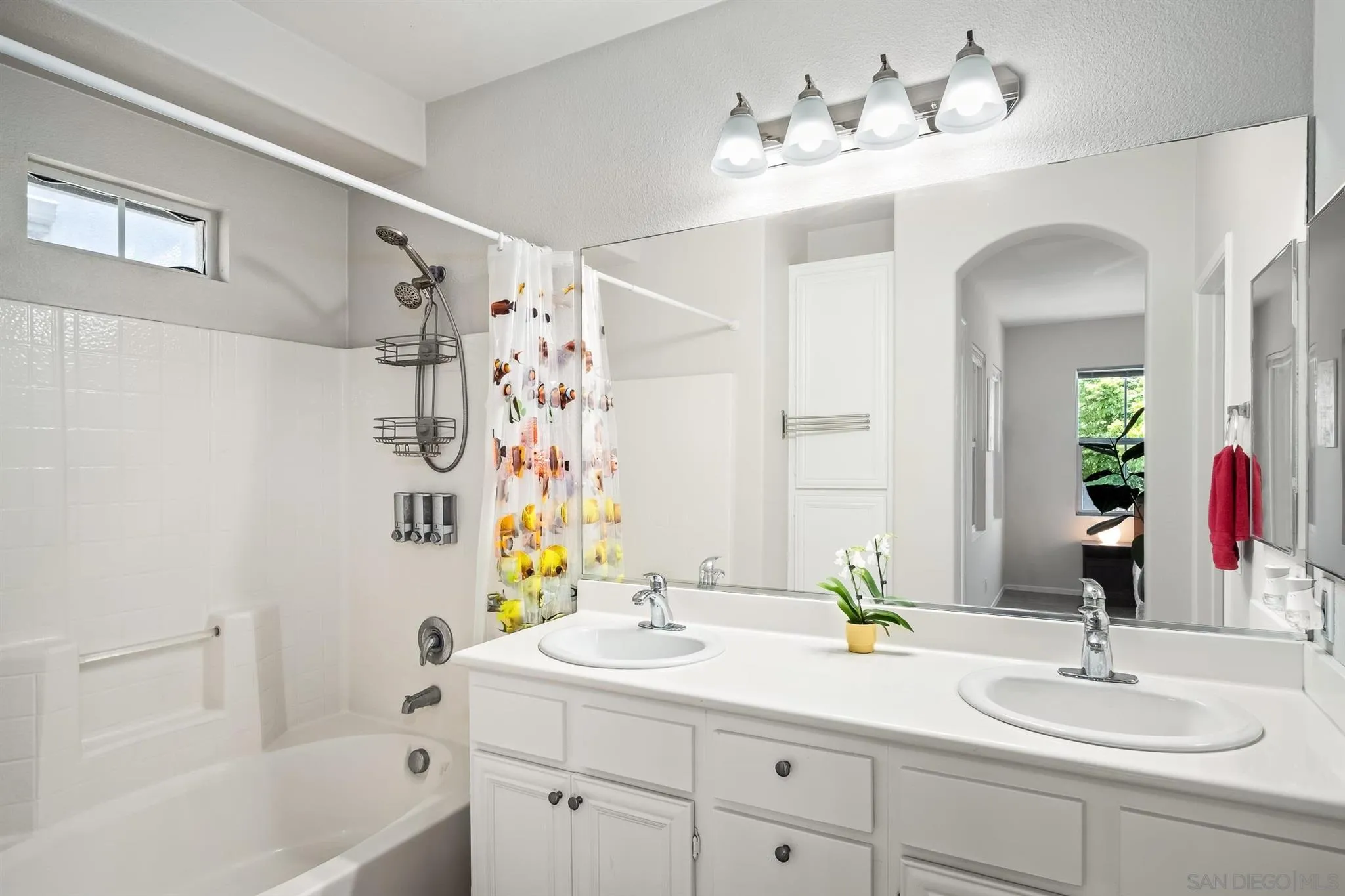 2732 Crown Ridge Road, Unit 1 Chula Vista, CA 91915 - Photo 18 of 32 a bathroom with a double vanity sink and a mirror