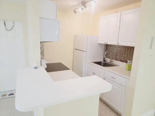 a bedroom with a bed and a cabinets