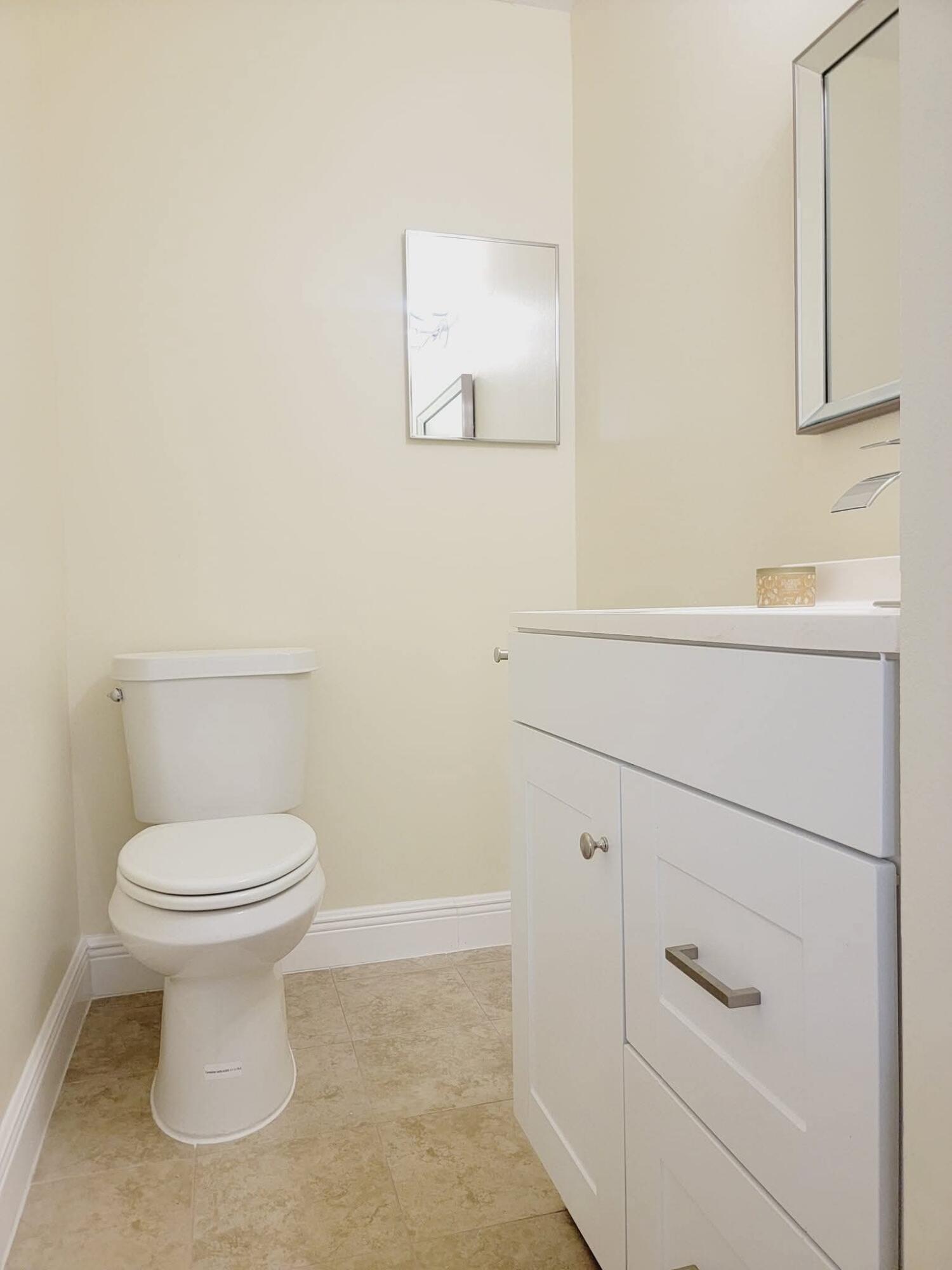 2 Crossings Circle, Unit B Boynton Beach, FL 33435 - Photo 7 of 12 a bathroom with a toilet and a sink