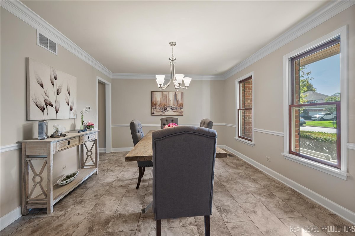 473 Bond Drive Batavia, IL 60510 - Photo 14 of 39 a living room with furniture a chandelier and a window