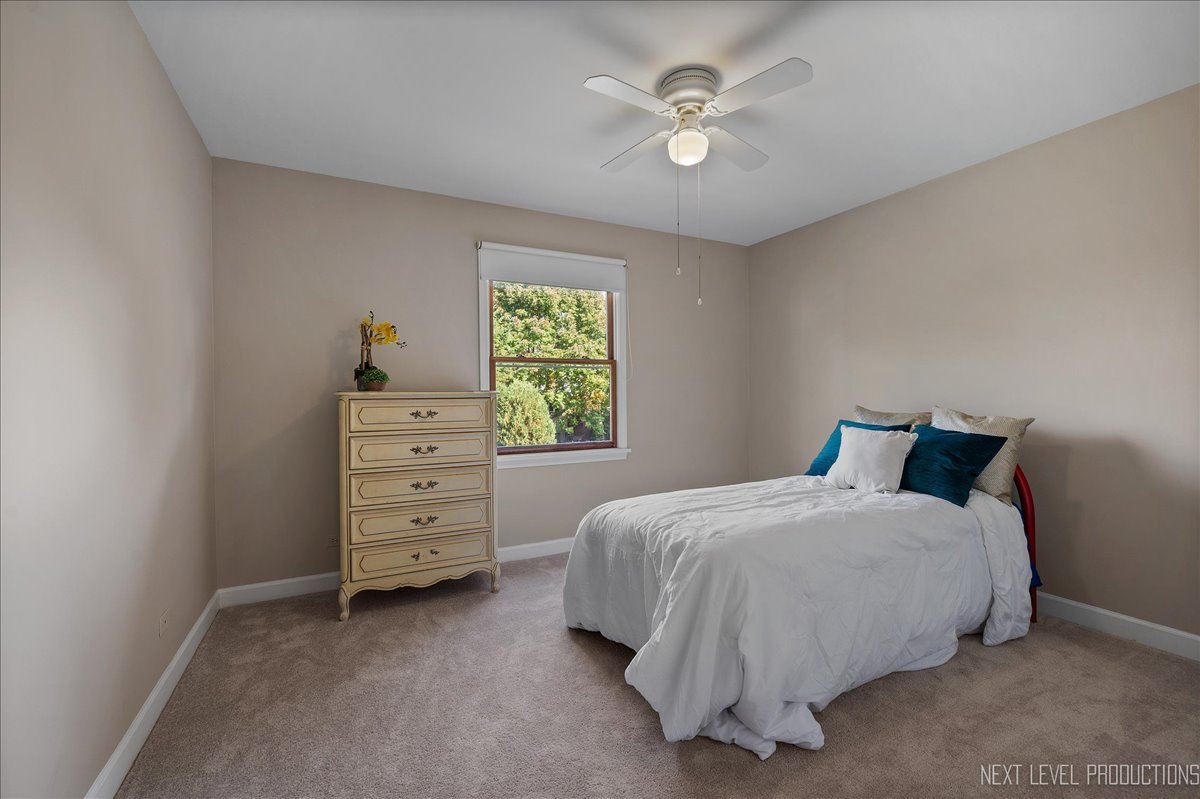 473 Bond Drive Batavia, IL 60510 - Photo 23 of 39 a bedroom with a bed and a window