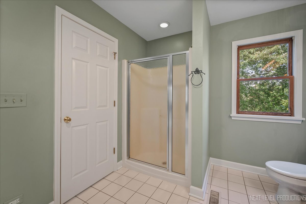 473 Bond Drive Batavia, IL 60510 - Photo 24 of 39 a bathroom with a shower and a toilet