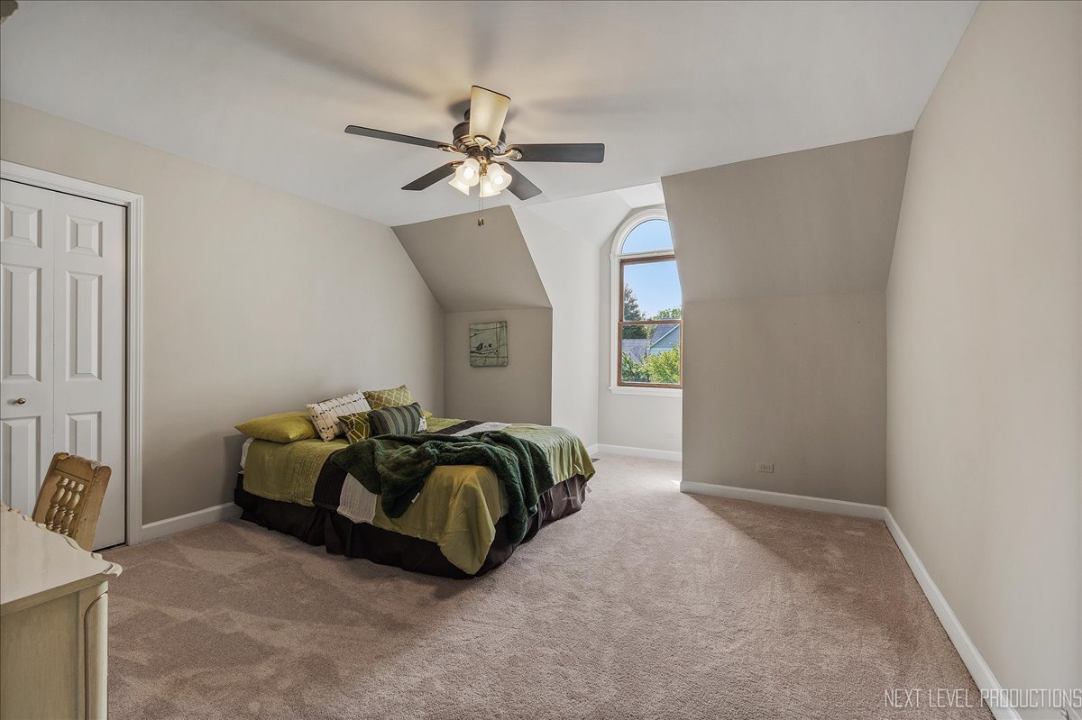 473 Bond Drive Batavia, IL 60510 - Photo 29 of 39 a bedroom with a bed and ceiling fan