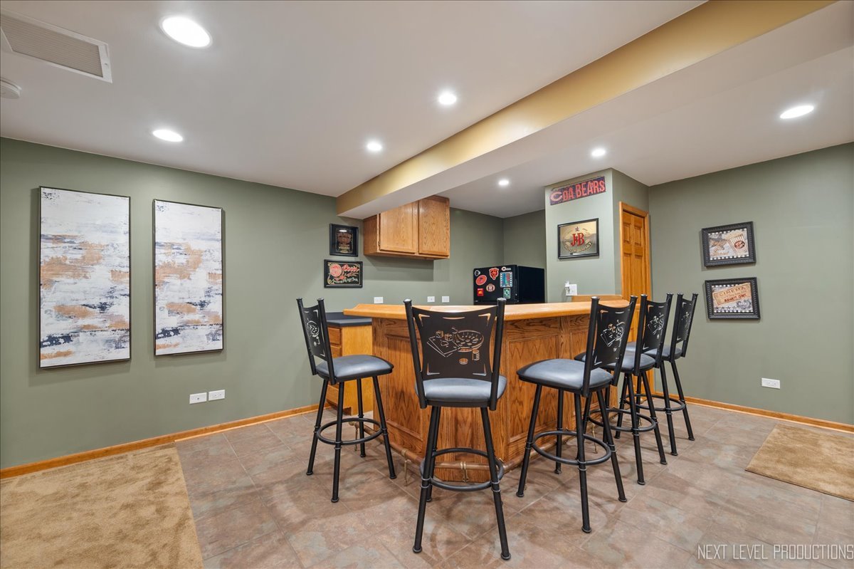 473 Bond Drive Batavia, IL 60510 - Photo 31 of 39 a view of a dining room with furniture and a window