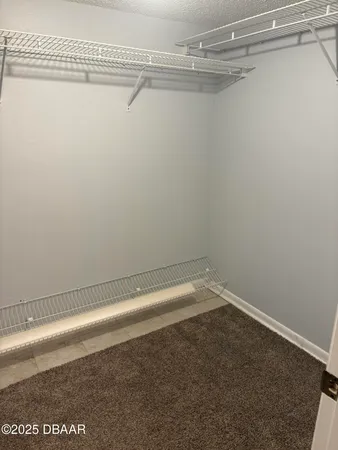 a view of a room with racks on the wall