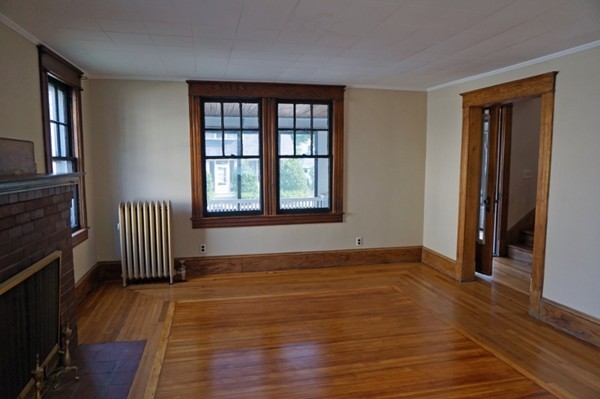 58 Shawmut Street Springfield, MA 01108 - Photo 15 of 26 a view of empty room with wooden floor and fan