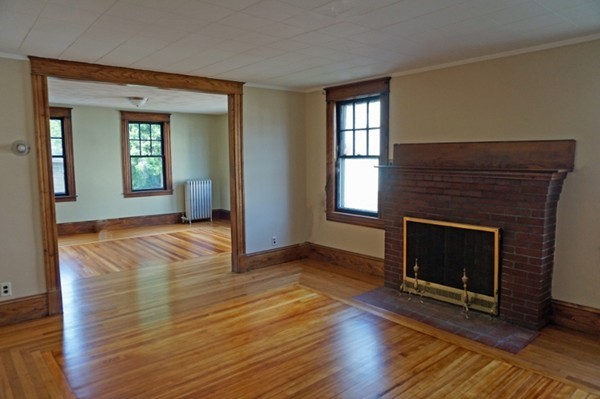 58 Shawmut Street Springfield, MA 01108 - Photo 18 of 26 a view of an empty room with wooden floor and a window