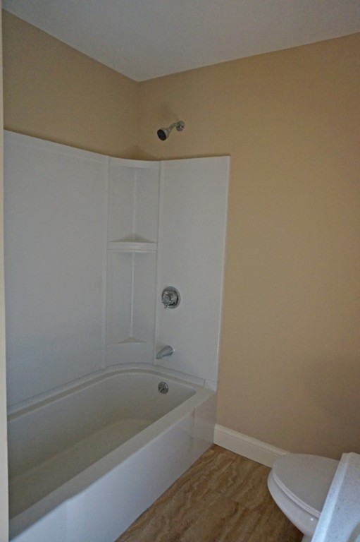 58 Shawmut Street Springfield, MA 01108 - Photo 20 of 26 a bathroom with a bathtub