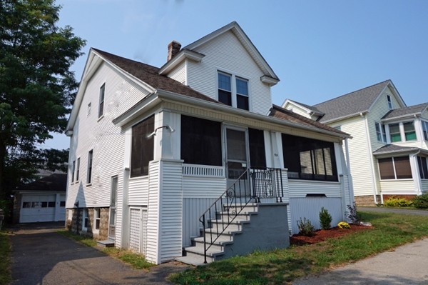 58 Shawmut Street Springfield, MA 01108 - Photo 2 of 26 a front view of a house with yard