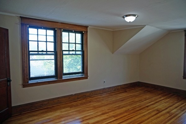 58 Shawmut Street Springfield, MA 01108 - Photo 21 of 26 a view of empty room with wooden floor and fan