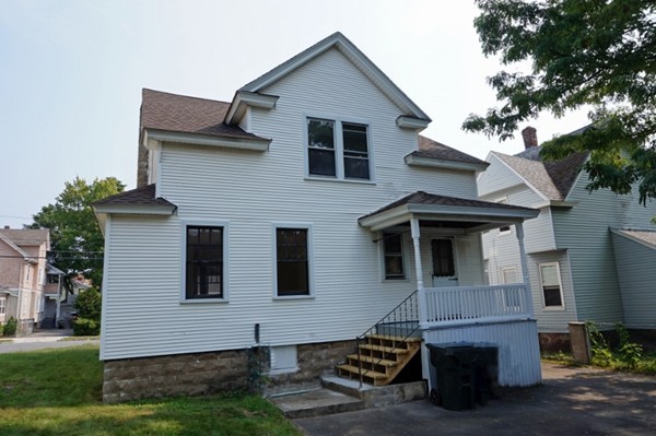 58 Shawmut Street Springfield, MA 01108 - Photo 4 of 26 a front view of a house with a yard