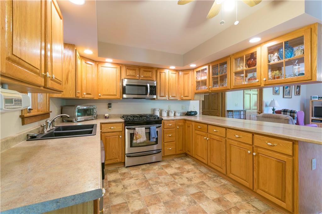 112 Bunker Hill Road Lagrange, ME 04453 - Photo 2 of 13 Kitchen with custom Oak cabinets