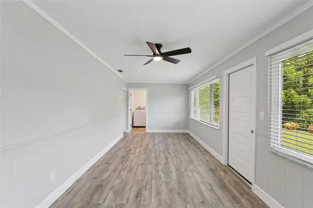 a view of an empty room with a fireplace