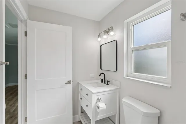 an aerial view of residential houses with city view