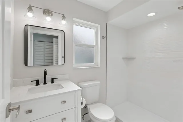 an aerial view of a residential houses with street