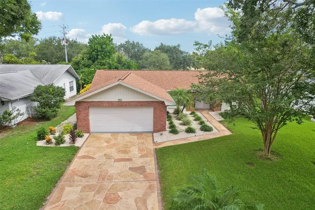 an aerial view of residential houses with outdoor space and street view
