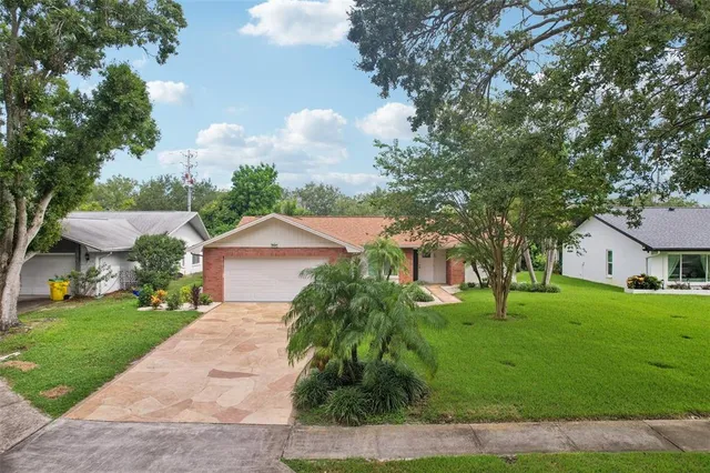 an aerial view of residential building with green space