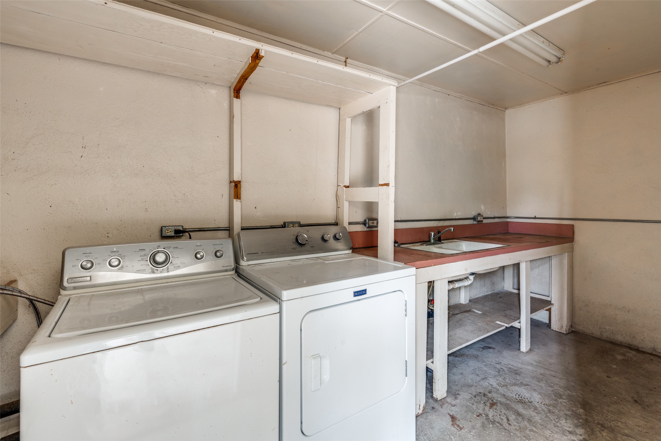520 South Pecan Avenue Luling, TX 78648 - Photo 19 of 23 Laundry room in the garage, separate storage area behind this as well.