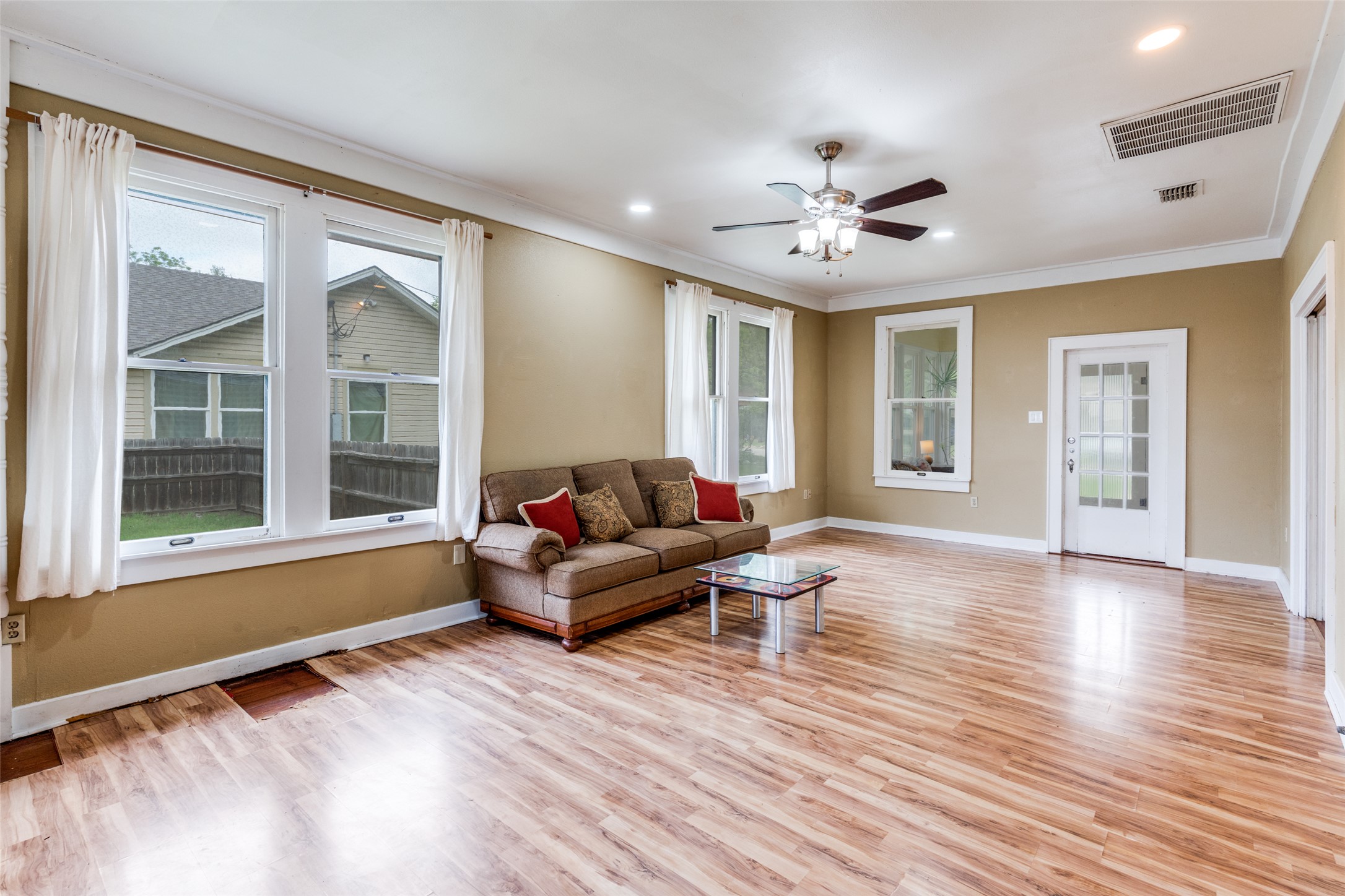 520 South Pecan Avenue Luling, TX 78648 - Photo 5 of 23 Original hardwood floors waiting under the laminate!