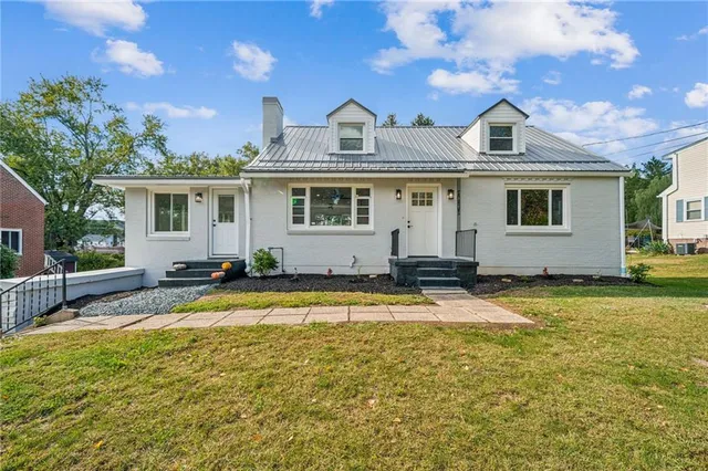 front view of a house with a swimming pool