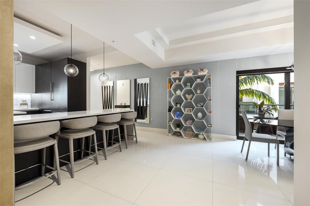 3030 North Ocean Boulevard, Unit S106 Fort Lauderdale, FL 33308 - Photo 11 of 40 a view of a chairs and table in a room