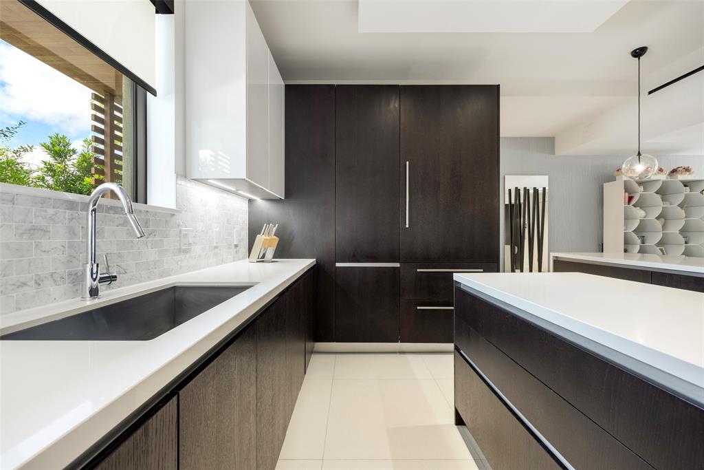 3030 North Ocean Boulevard, Unit S106 Fort Lauderdale, FL 33308 - Photo 14 of 40 a kitchen with a sink and a refrigerator