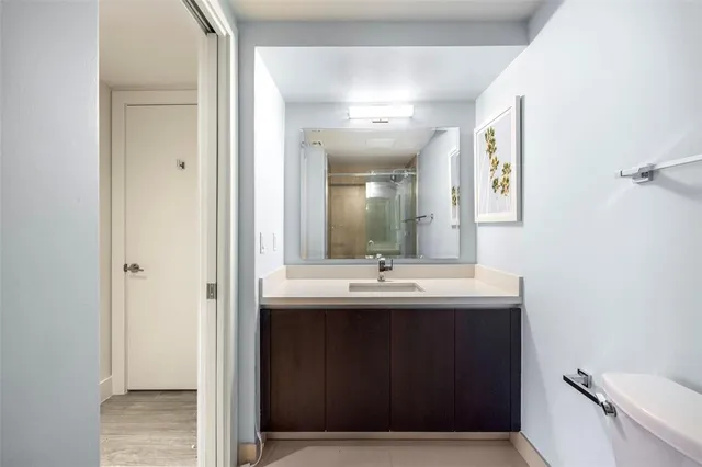 a bathroom with double sink and mirror
