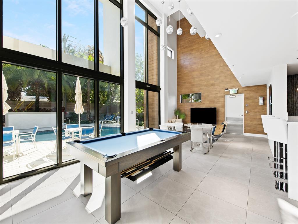 3030 North Ocean Boulevard, Unit S106 Fort Lauderdale, FL 33308 - Photo 32 of 40 a room with pool table and glass windows
