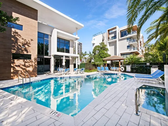 a view of swimming pool with outdoor seating