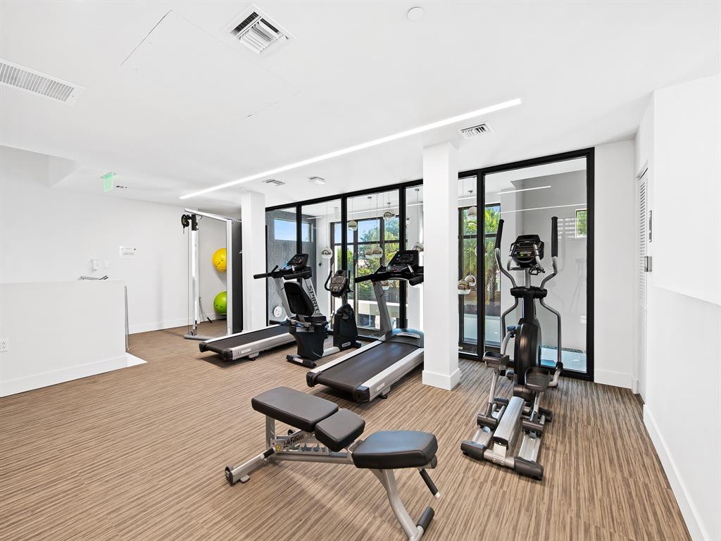 3030 North Ocean Boulevard, Unit S106 Fort Lauderdale, FL 33308 - Photo 36 of 40 a view of a room with gym equipment