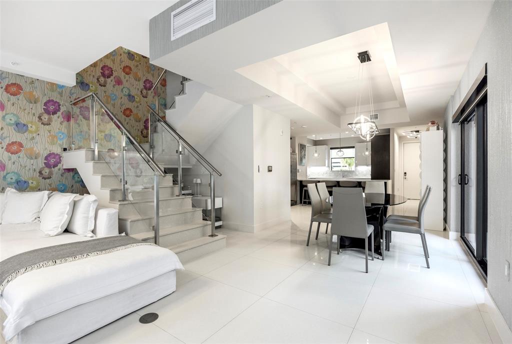 3030 North Ocean Boulevard, Unit S106 Fort Lauderdale, FL 33308 - Photo 5 of 40 a living room with furniture and wooden floor