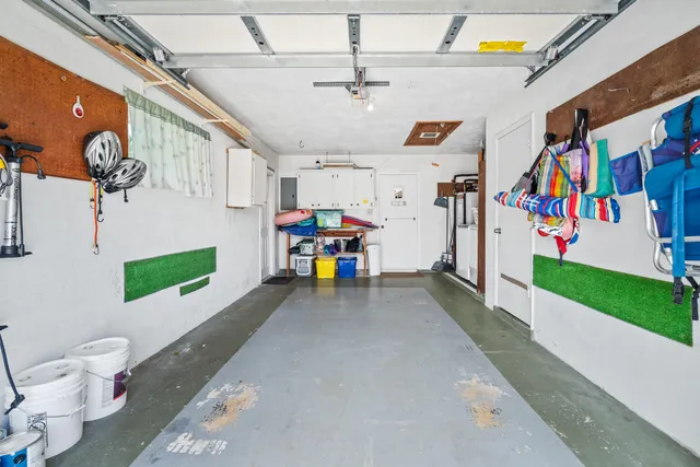 a utility room with multiple dryer and washer