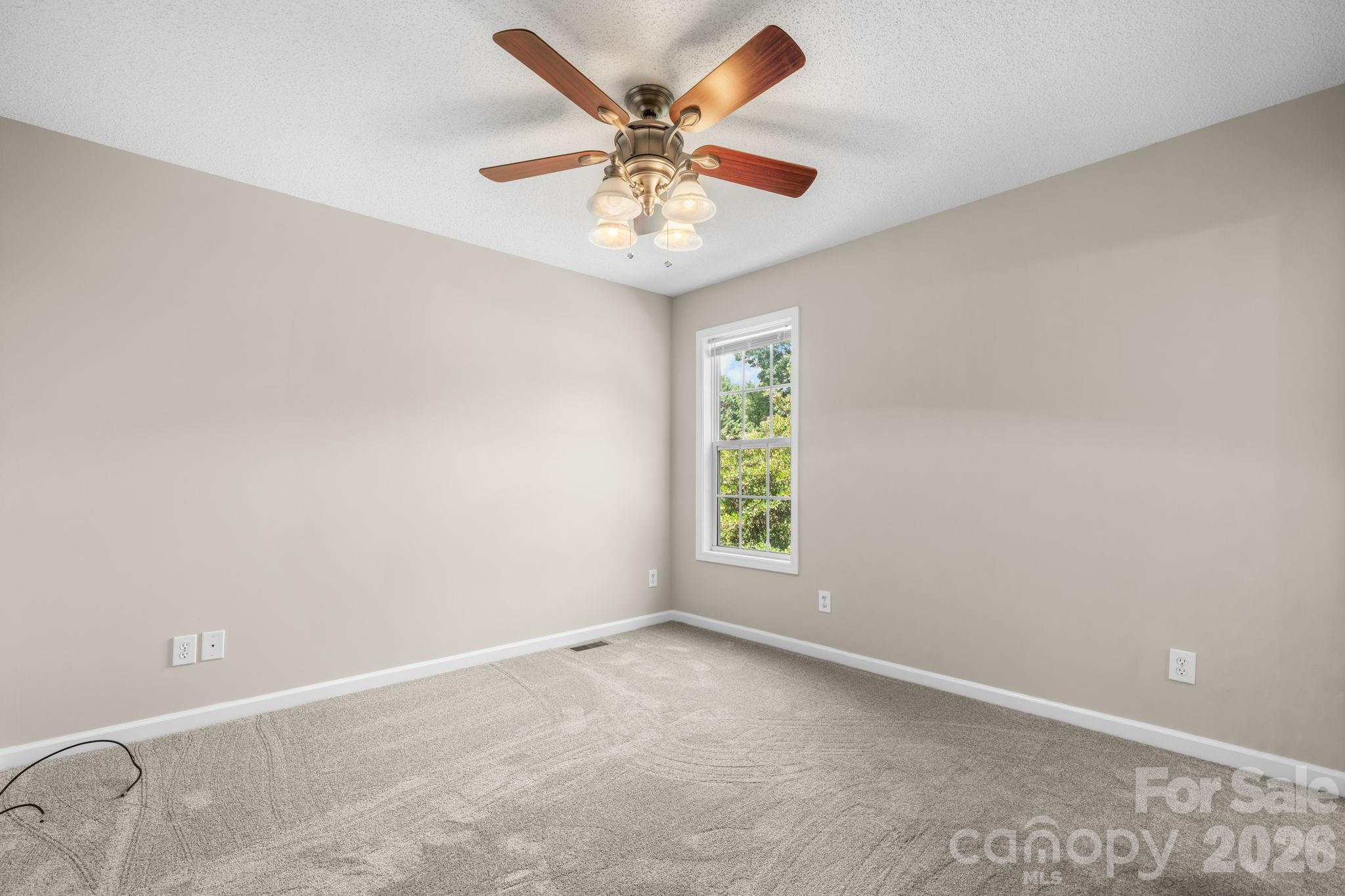 4967 Addison Lane Hickory, NC 28601 - Photo 14 of 43 an empty room with windows and ceiling fan