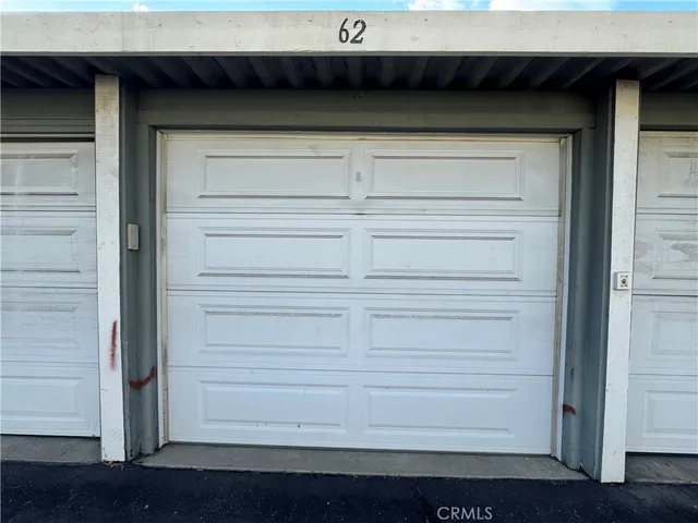 a view of a brick building next to a yard