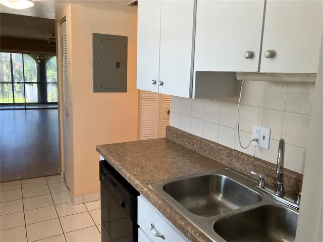 a kitchen with a sink and cabinets